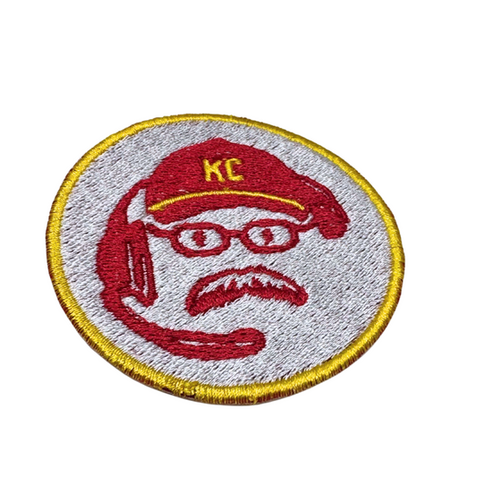 Close-up angle of the Coach Reid patch showing embroidery texture and colors
