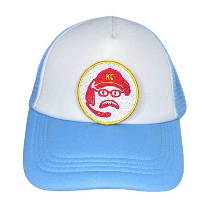 Lifestyle photo showing the KC coach patch on a blue and white trucker hat

