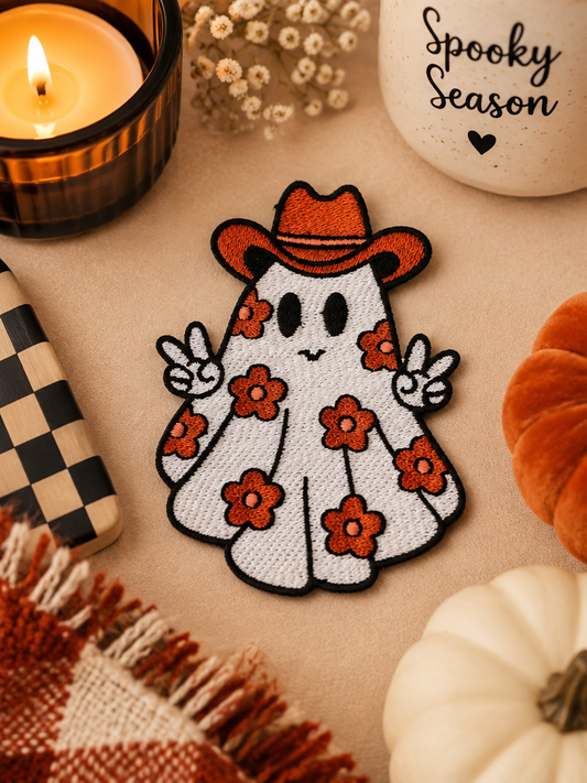 Cowboy Ghost embroidered iron-on patch styled with warm spooky season decor