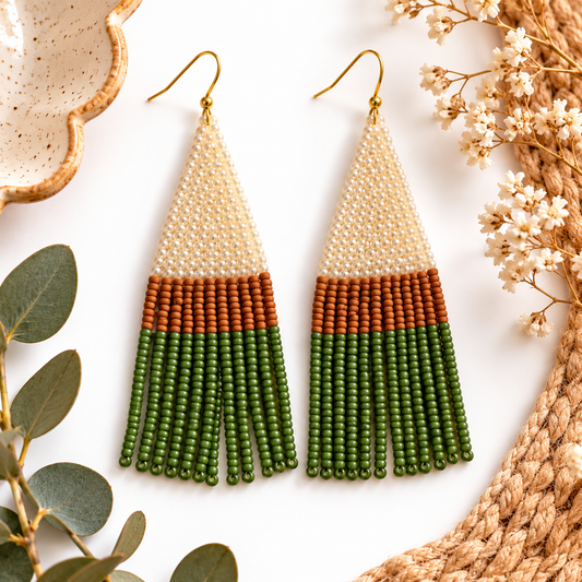 Cream and olive hand-beaded fringe earrings styled hero photo