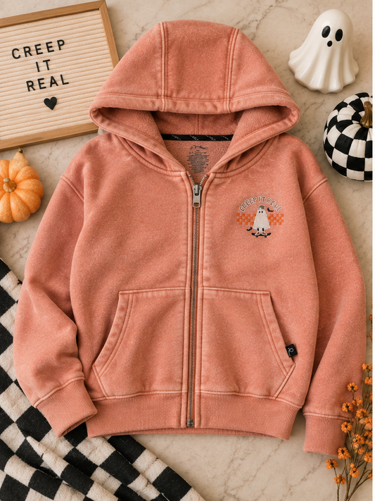 Youth Creep It Real Halloween zip hoodie styled with spooky fall decor
