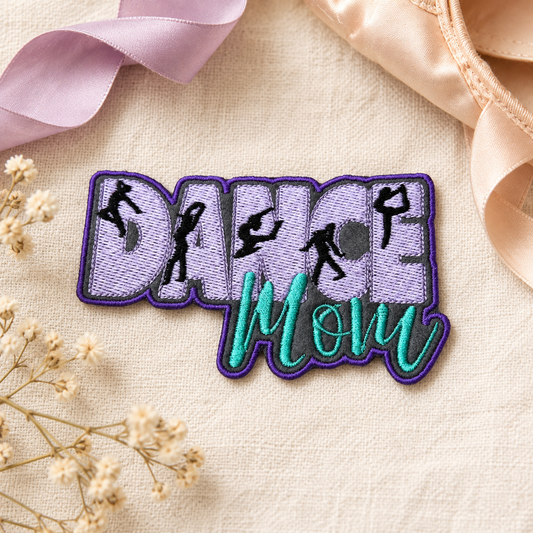 Lavender and teal Dance Mom embroidered patch styled on cream linen with ballet accessories