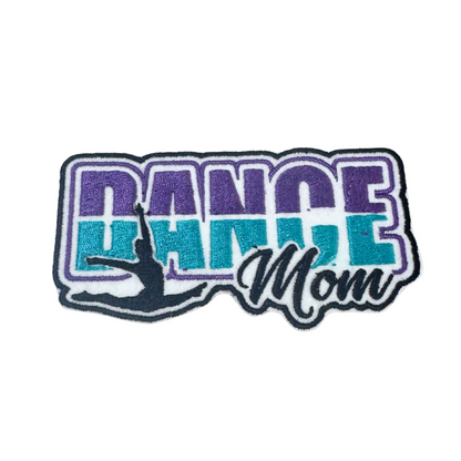 Embroidered patch featuring the words "Dance Mom" in bold purple and teal with a dancer silhouette in the design.
