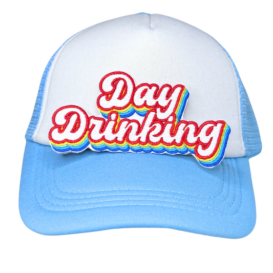 Day Drinking patch with rainbow accents on blue and white trucker hat

