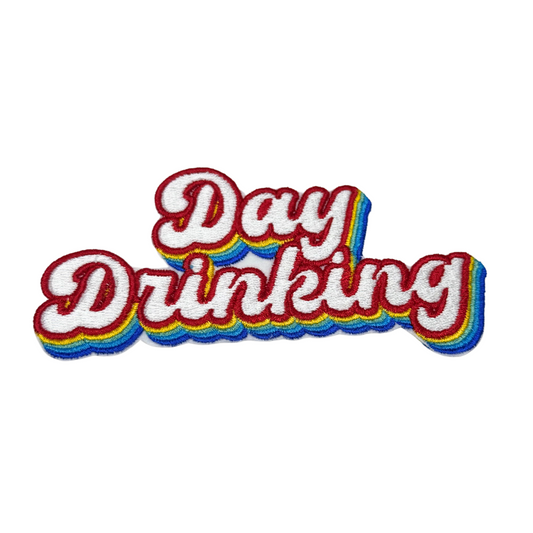 Retro embroidered patch that says “Day Drinking” in red with rainbow shadow
