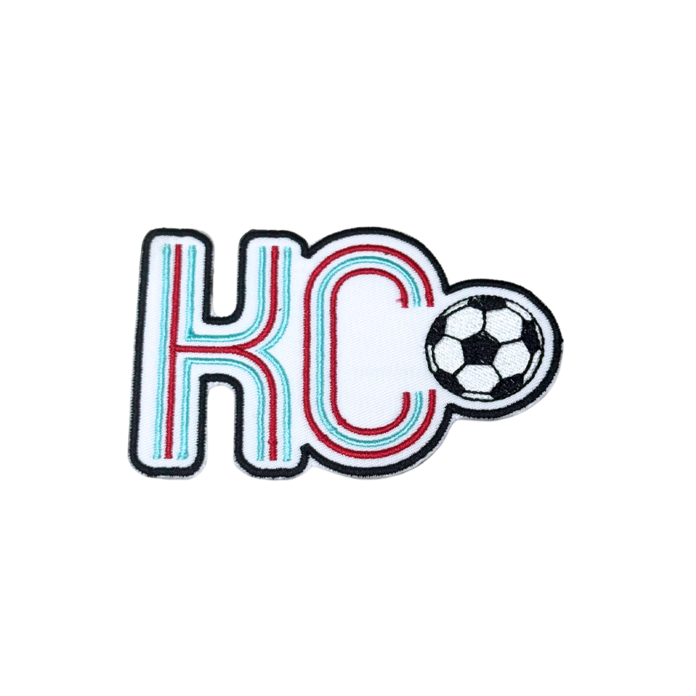 Hero image of KC soccerball patch with red, aqua, and black embroidery

