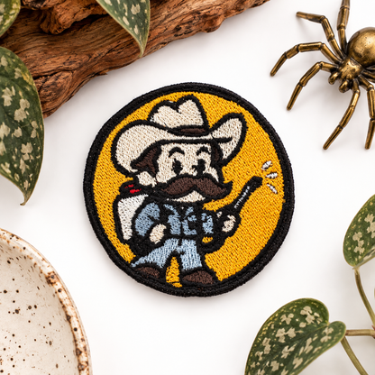 Delbert McClintock Arachnophobia embroidered patch styled on white background
