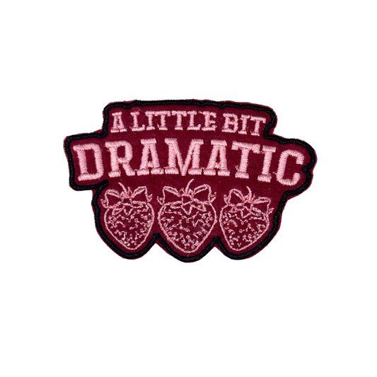 “embroidered strawberry patch with text a little bit dramatic”
