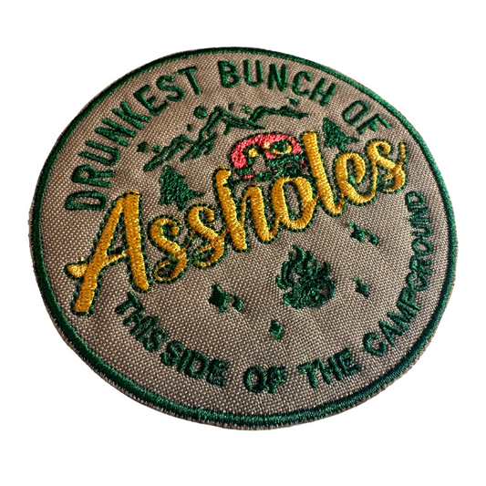 Angle view of embroidered "Drunkest Bunch of Assholes" patch showing stitching detail
