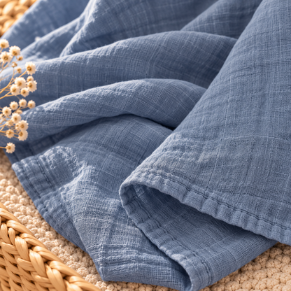 Dusty blue cotton gauze baby swaddle fabric texture and finished edge
