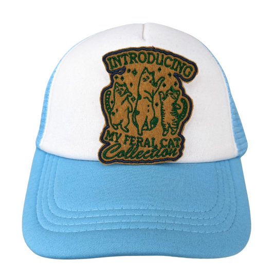 Feral Cat Collection patch on blue and white trucker hat
