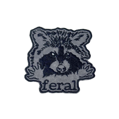 Front view of feral raccoon embroidered iron-on patch
