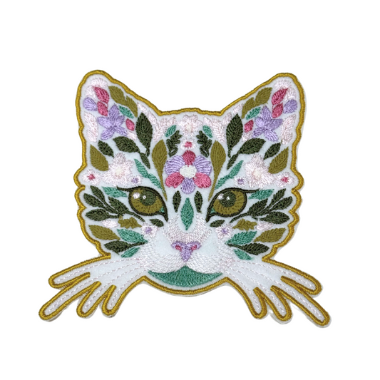 Front view of floral cat face embroidered iron-on patch with botanical details
