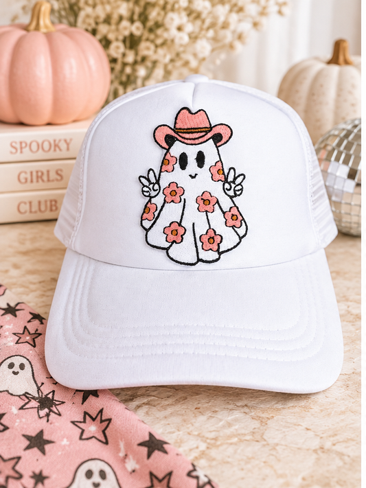 White Floral Cowboy Ghost Halloween trucker hat styled with pink pumpkins and spooky decor