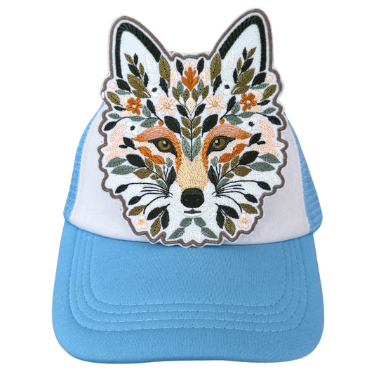 Floral fox patch heat-pressed onto blue and white trucker hat
