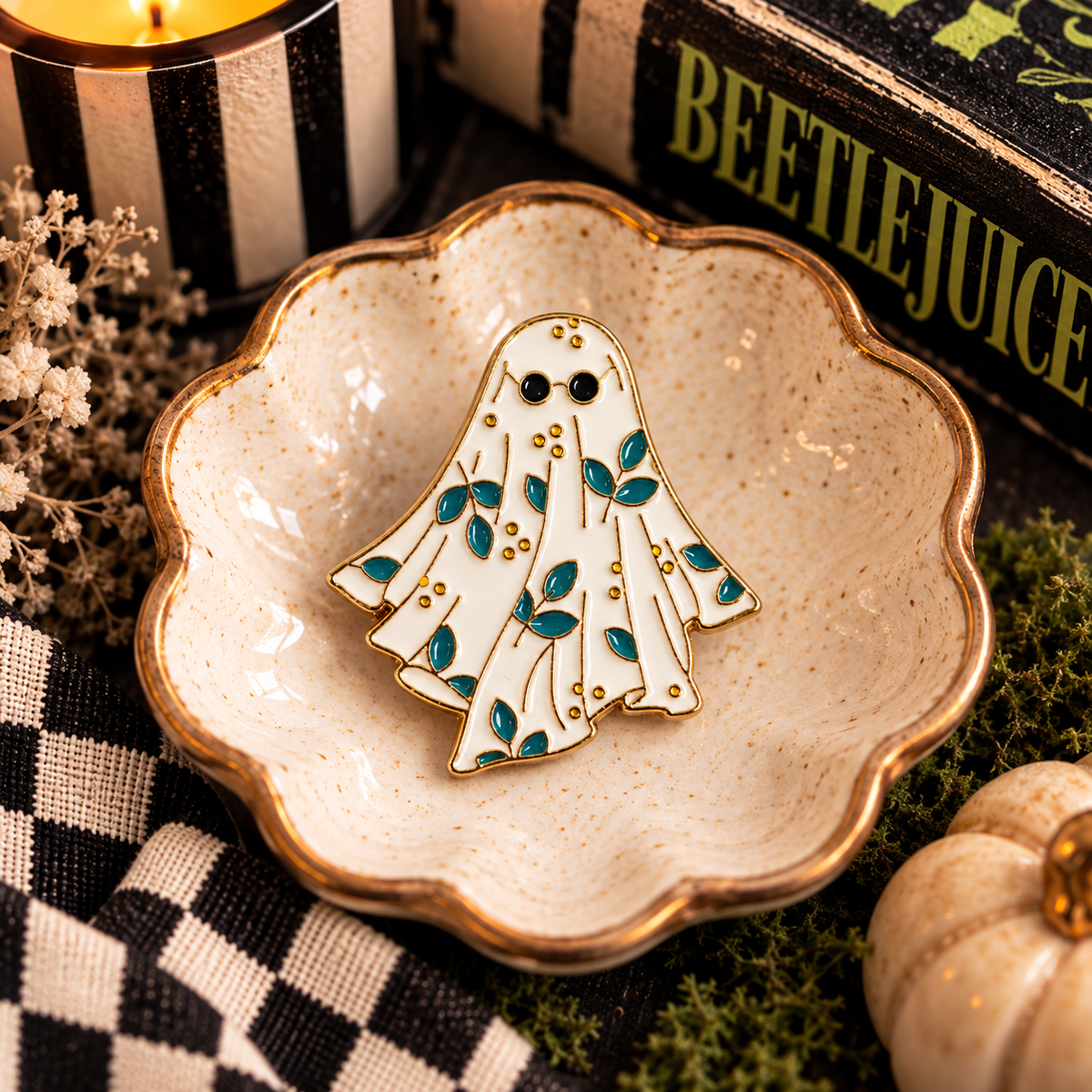 Floral ghost enamel pin with teal leaves and round sunglasses hero image