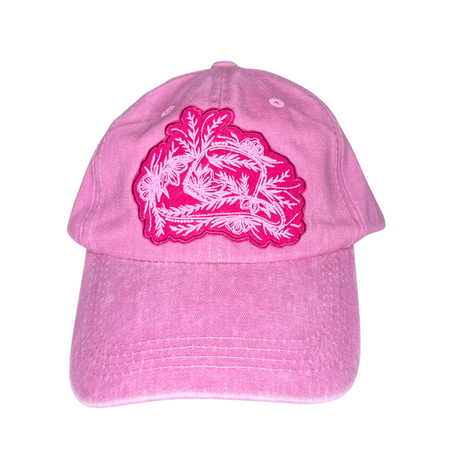 Pink cap with a light pink floral design on a white background