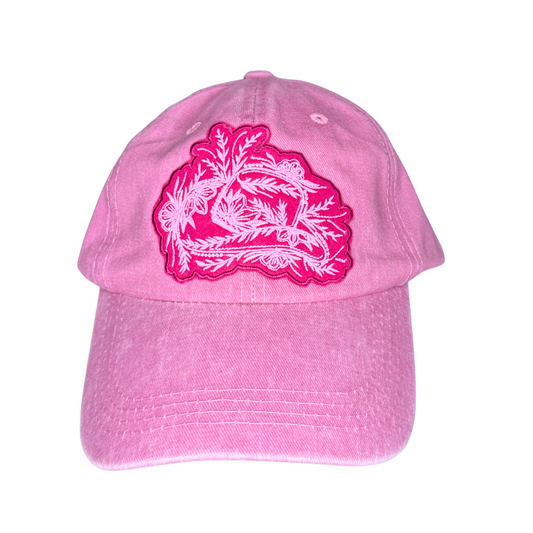 Pink cap with a light pink floral design on a white background