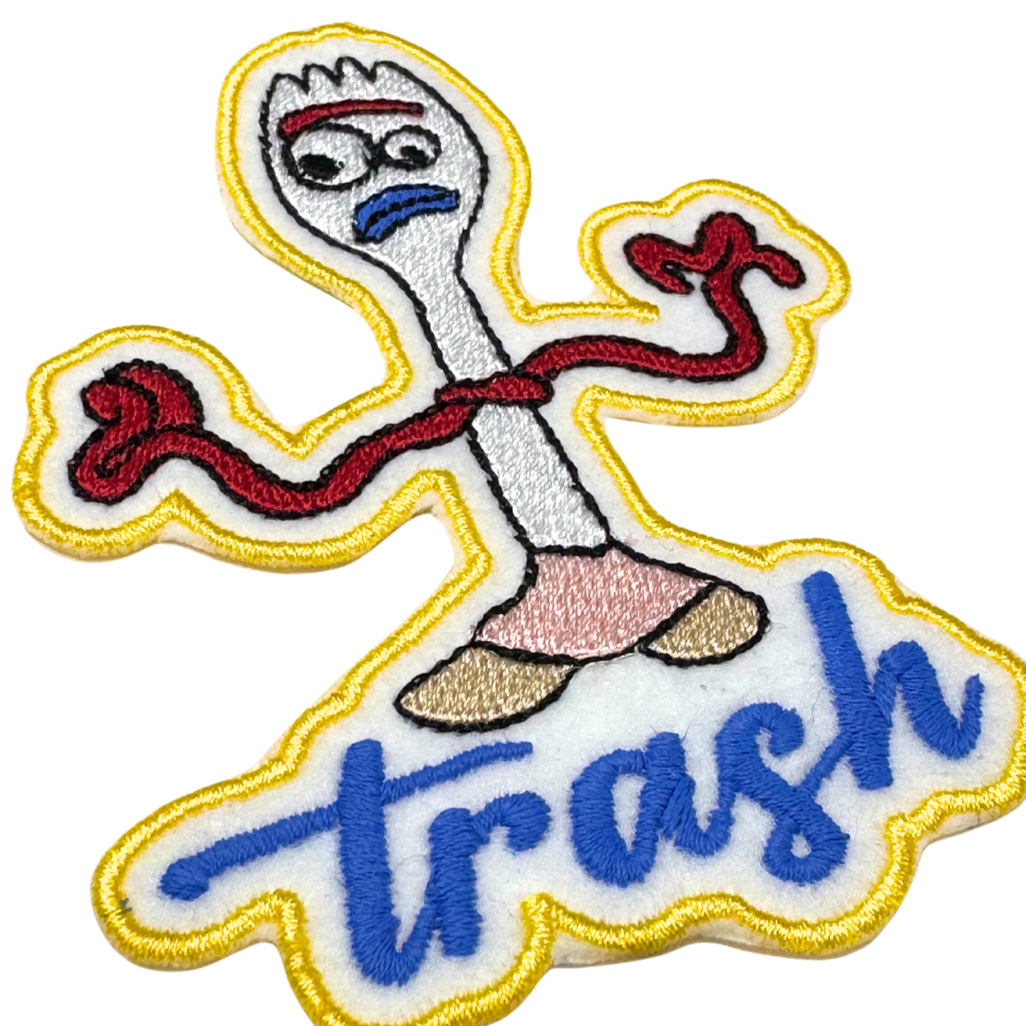 Angled close-up showcasing texture and embroidery detail of Forky patch