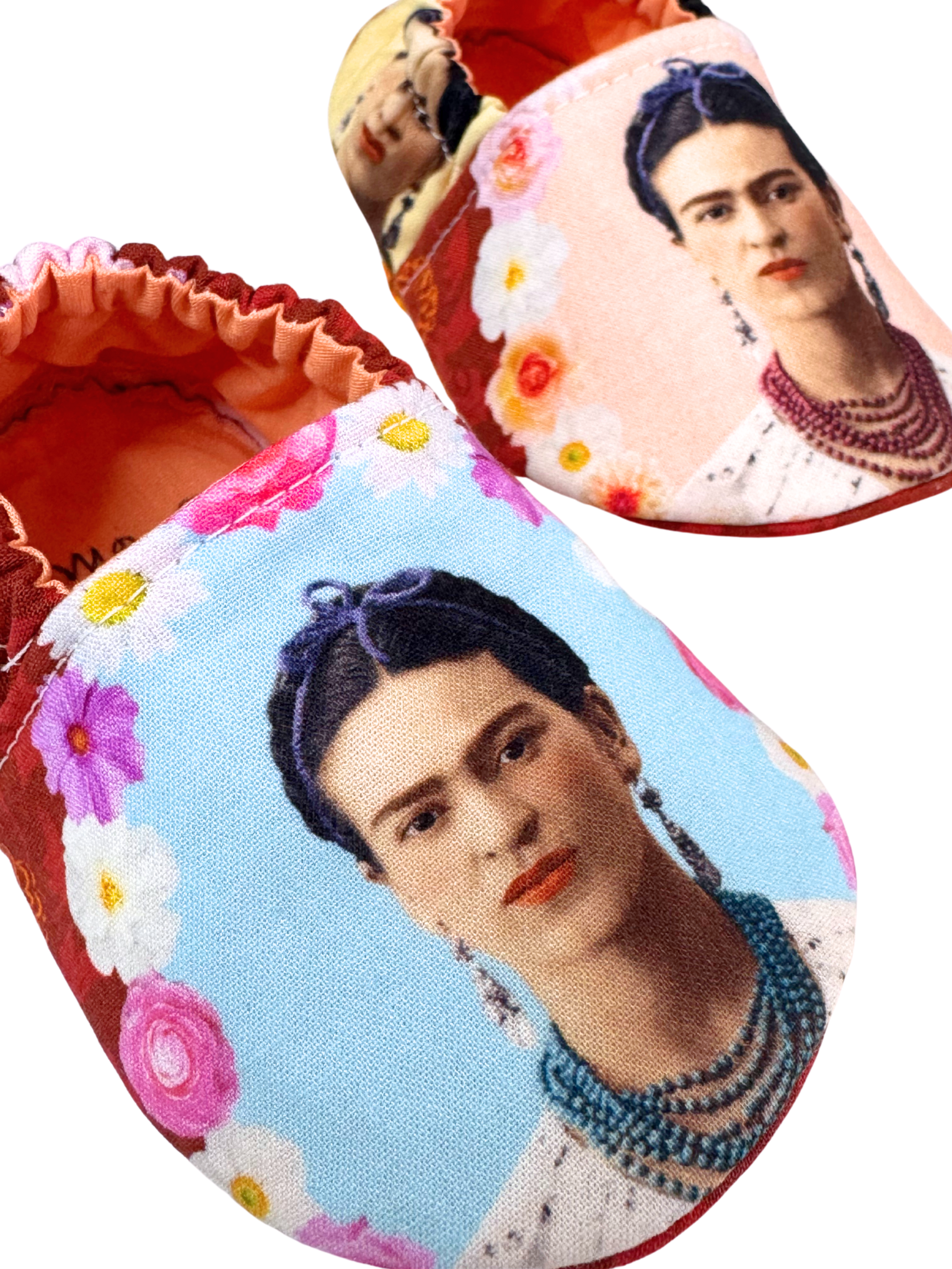 “Close-up of Frida Kahlo baby shoes with floral portraits and red interior, handmade, 3–6 months”

