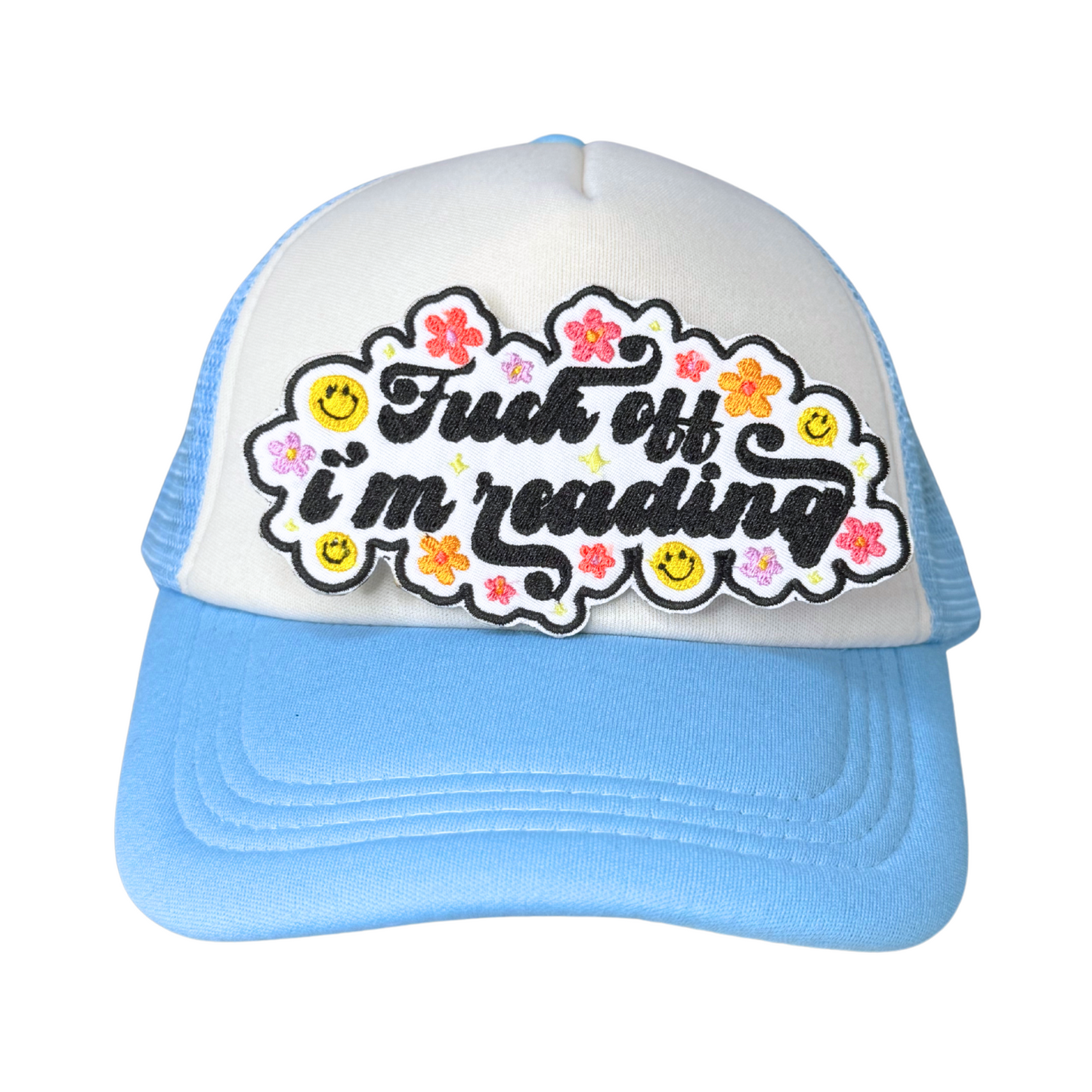 patch displayed on a light blue and white trucker hat