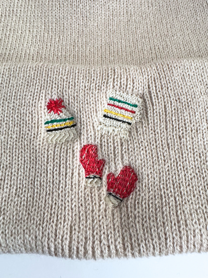 Original detail view of cream embroidered winter beanie
