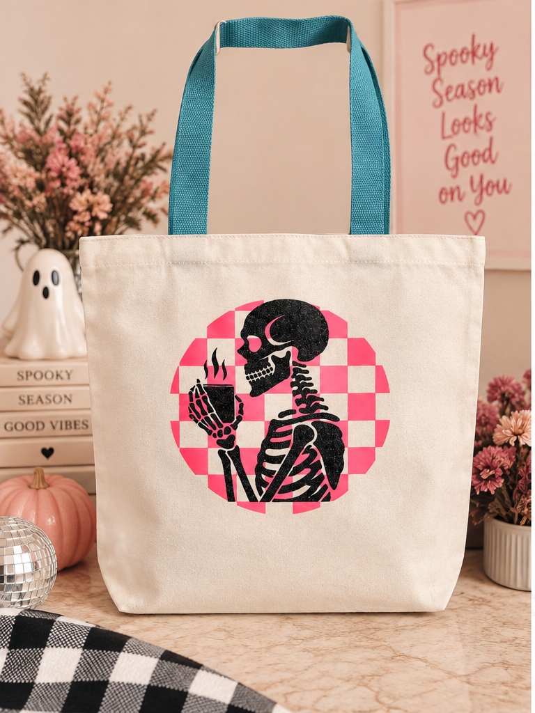 Glitter skeleton Halloween tote with pink checkerboard design and teal handles
