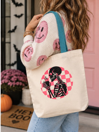 Lifestyle view of glitter skeleton Halloween tote carried over the shoulder