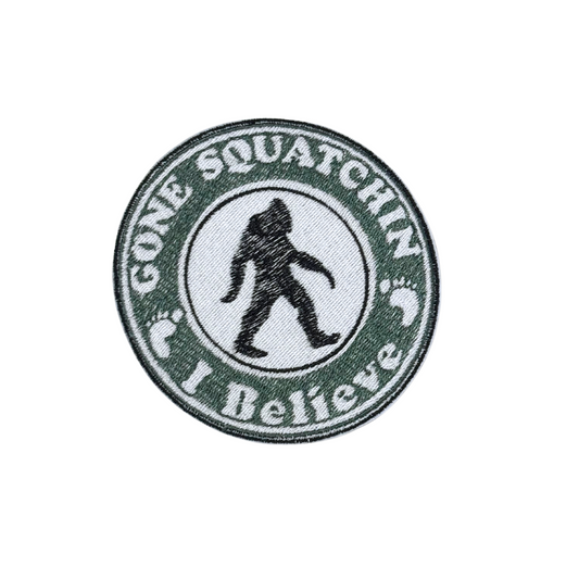 Close-up of an embroidered "Gone Squatchin' – I Believe" patch featuring a Sasquatch silhouette.

