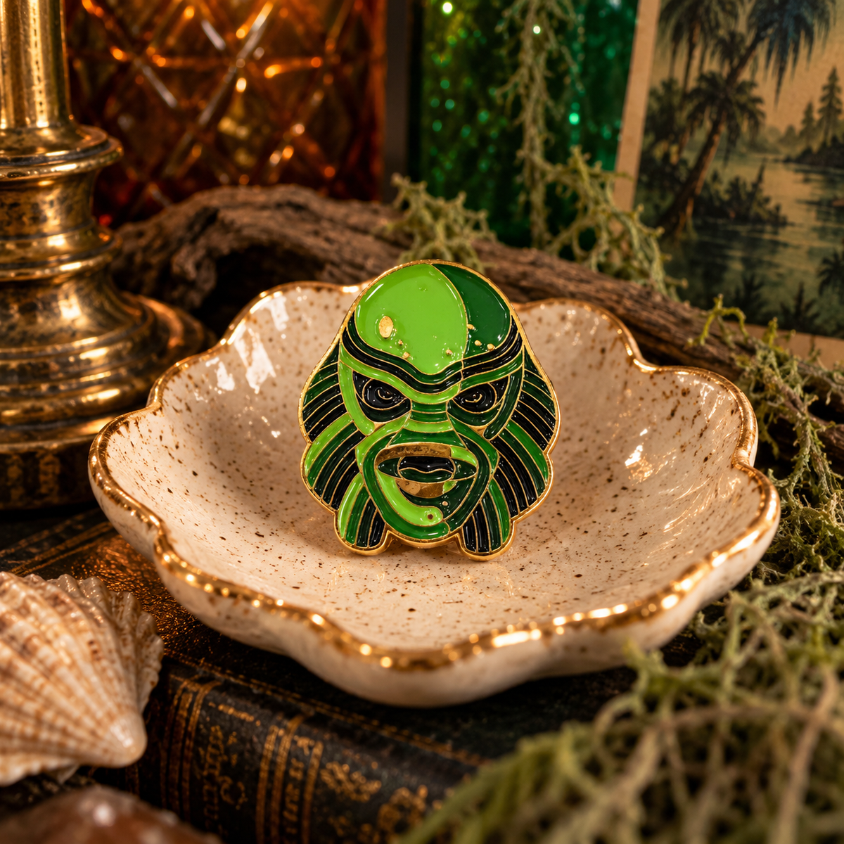 Green and gold retro aquatic monster enamel pin in a swampy vintage scene