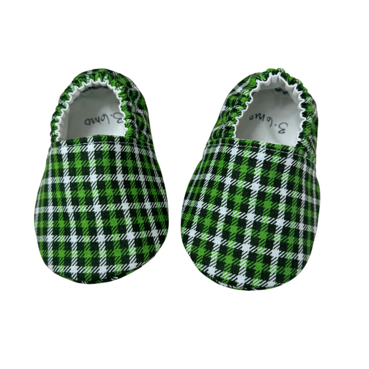 “Handmade soft sole baby shoes in green plaid pattern, front view, size 3-6 months”

