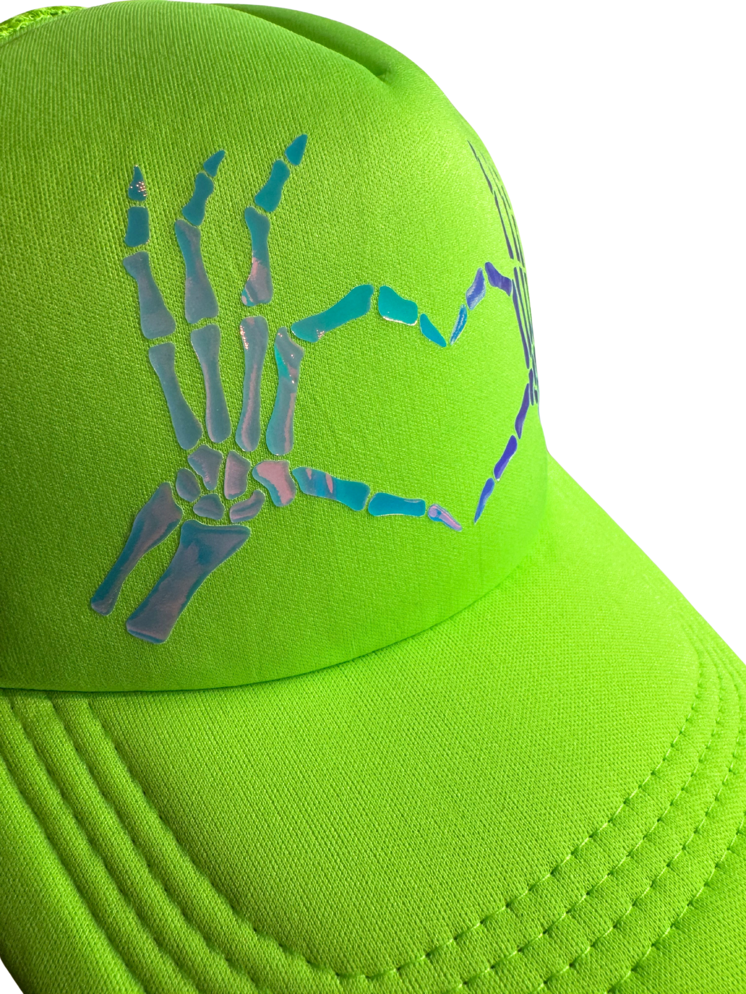 Green cap with a skeleton hand design on a white background