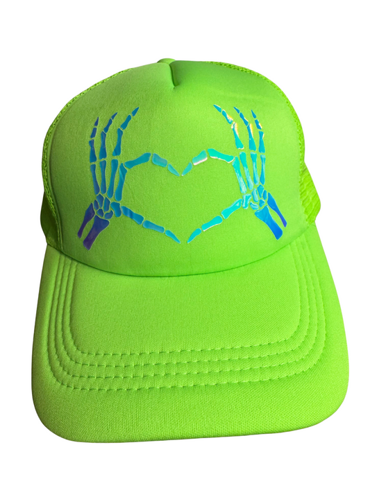 Neon green cap with skeleton hand and heart design on a white background