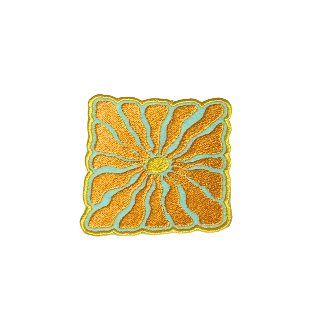 Handmade embroidered yellow and teal sun patch on white background