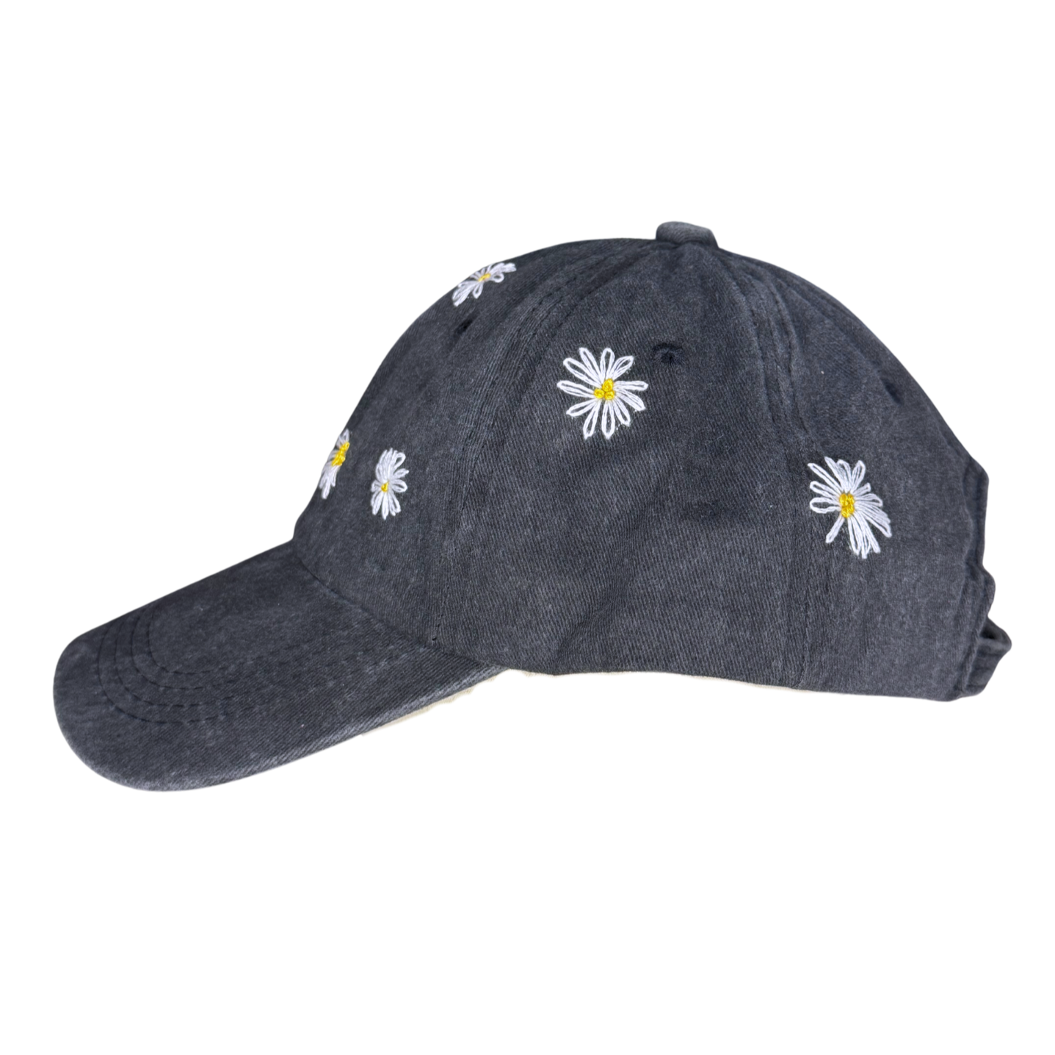 Dark denim cap with white daisy flowers on a white background