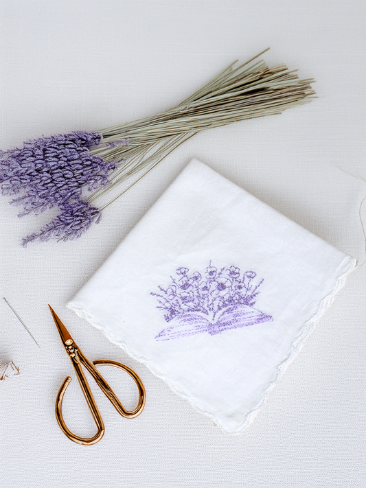 Handmade white handkerchief embroidered with a lavender book and flower design