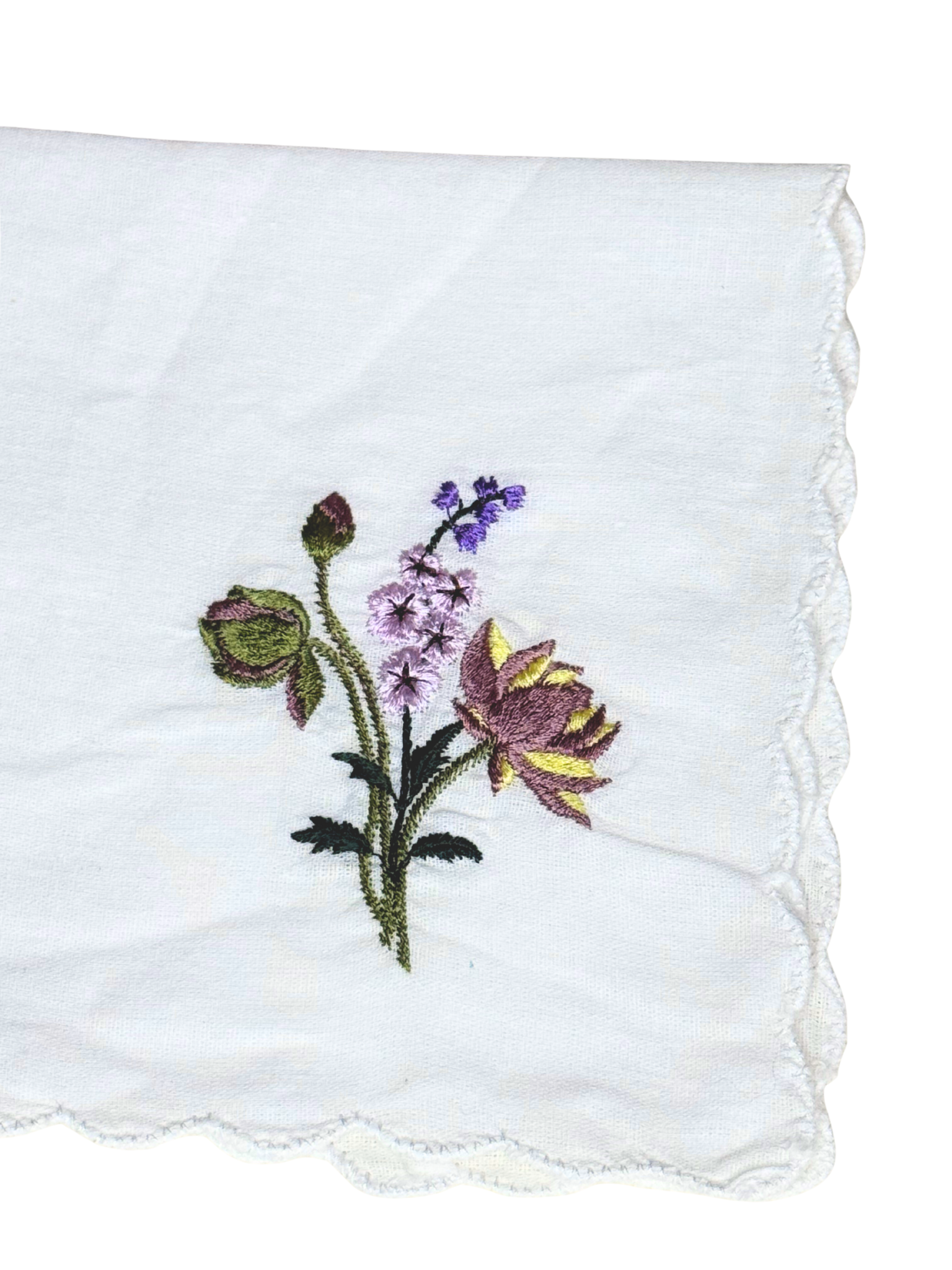 Close-up of July birth month flower embroidery on white scalloped edge handkerchief

