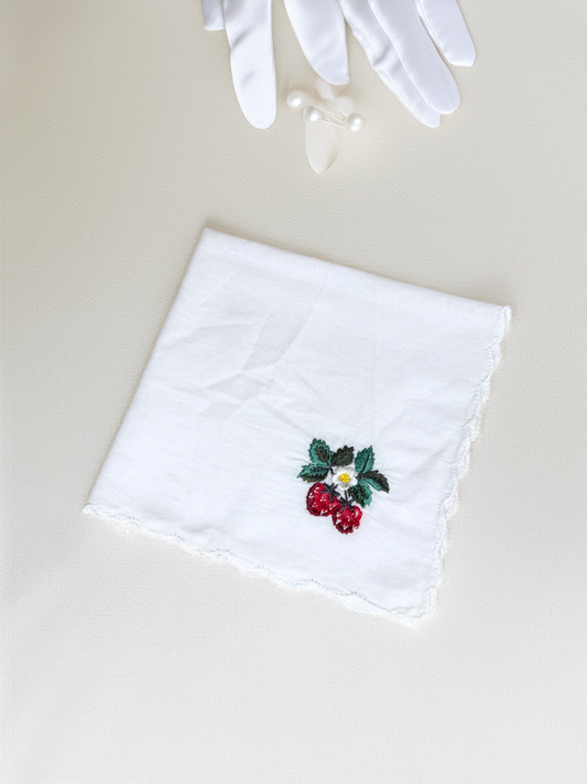 White handkerchief with embroidered red strawberries and green leaves

