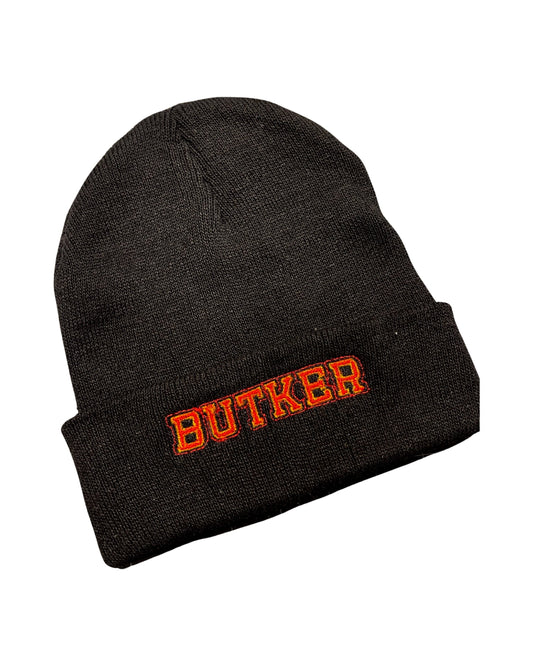 black knit beanie embroidered in red and yellow with "BUTKER" for Harrison Butker, kicker for the Kansas City chiefs