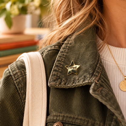 I Tried gold star enamel pin worn on an olive corduroy jacket