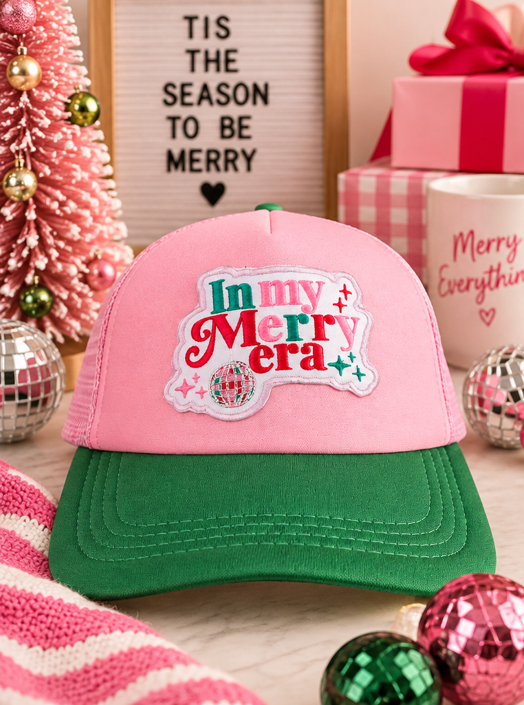 In My Merry Era pink and green trucker hat styled holiday product photo
