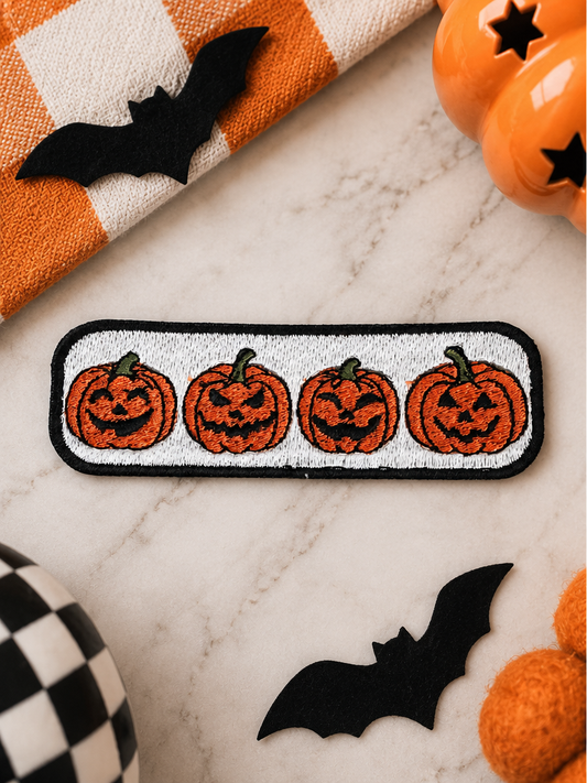 Jack-O'-Lantern Parade embroidered iron-on patch styled for Halloween