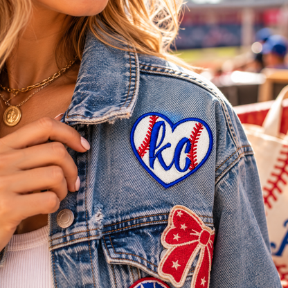 KC Baseball Heart Iron-On Patch styled on denim jacket at baseball game