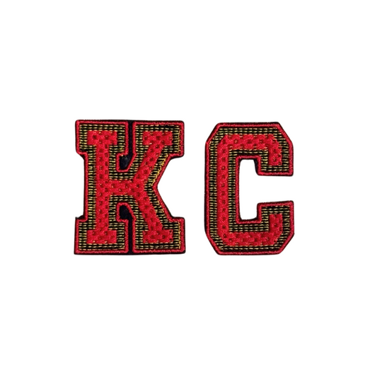 Red and gold chenille varsity KC patch with black outline
