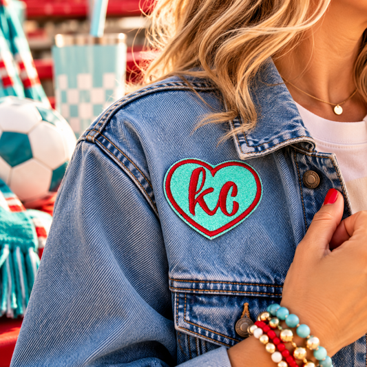 KC Current heart iron-on patch styled on denim jacket