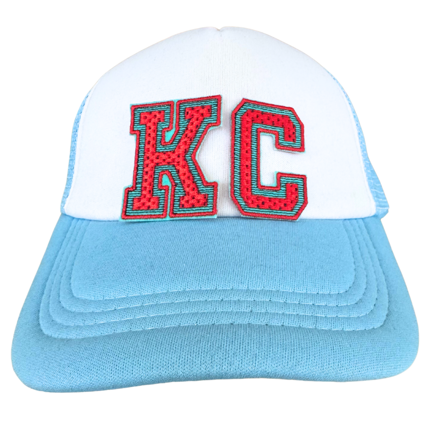 Trucker hat featuring KC Current-inspired varsity chenille patch in red and teal

