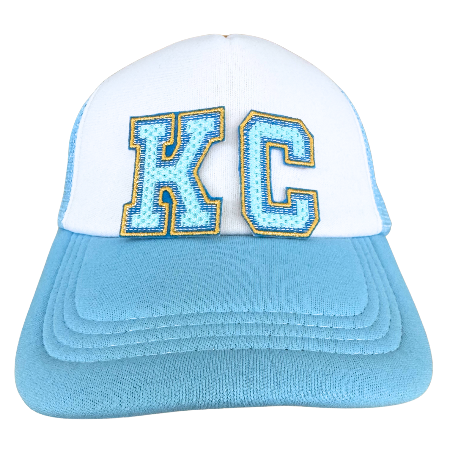 Trucker hat with KC light blue chenille patch in Royals colors with varsity-style letters

