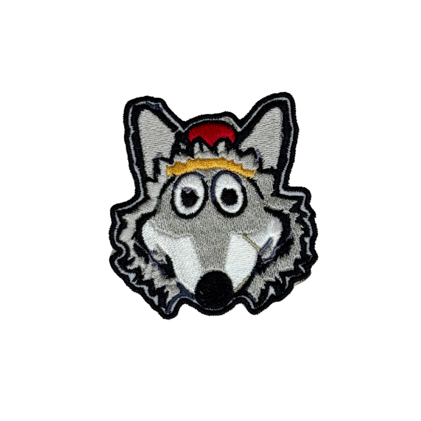 Close-up of embroidered KC Wolf iron-on patch on white background