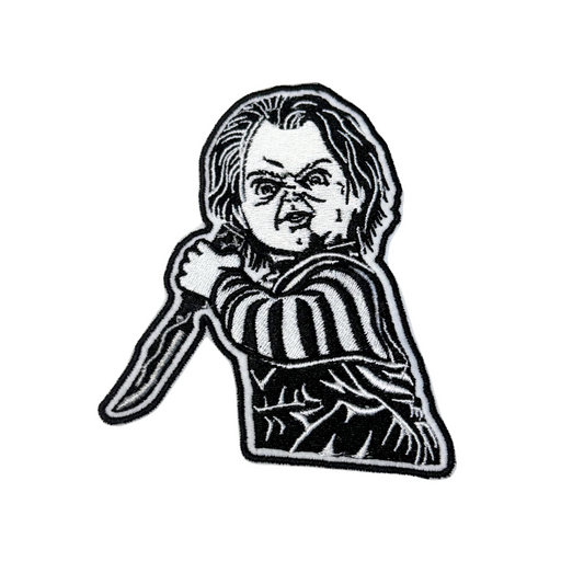 Black and white embroidered killer doll patch with knife on white background

