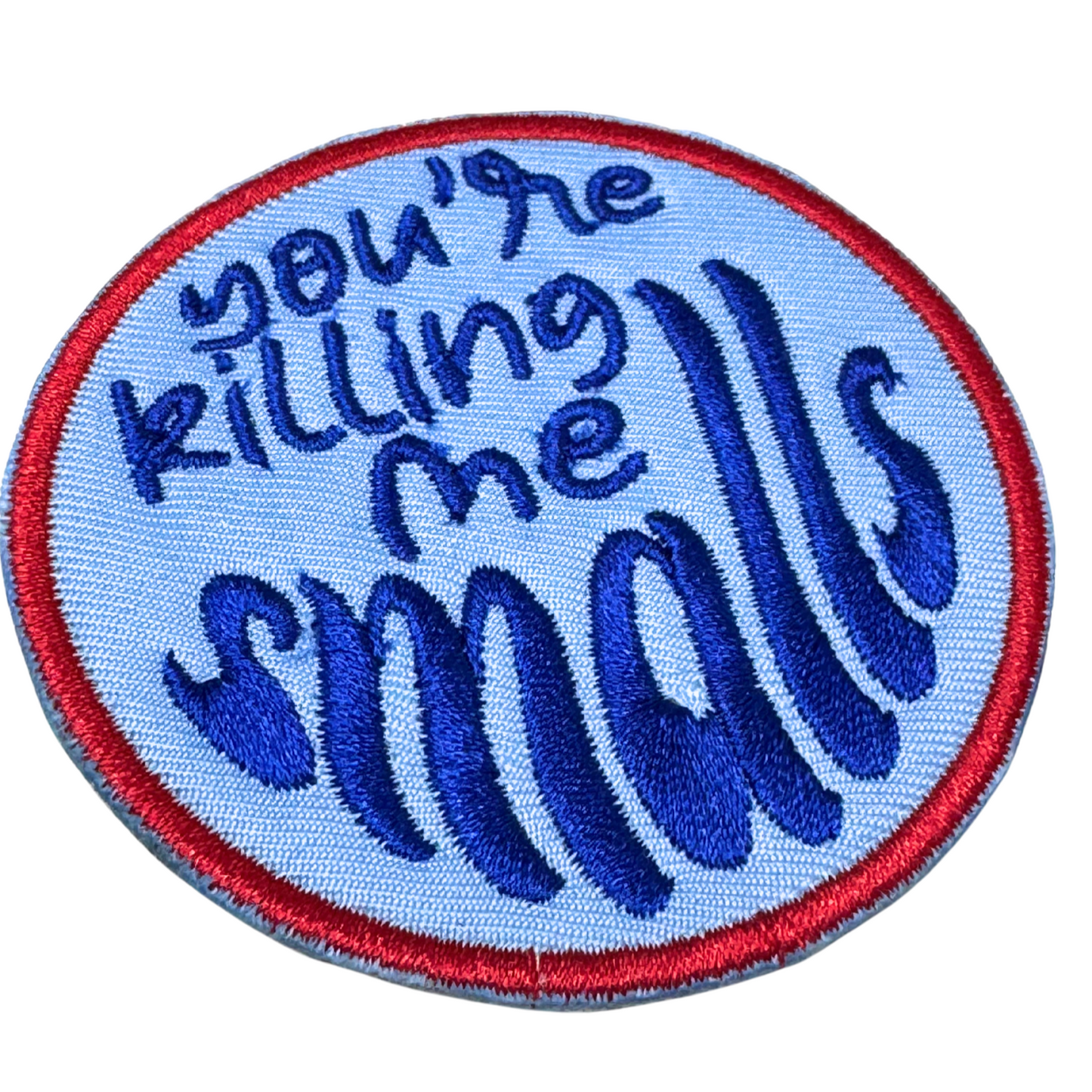 Side angle detail of embroidery stitches on the patch